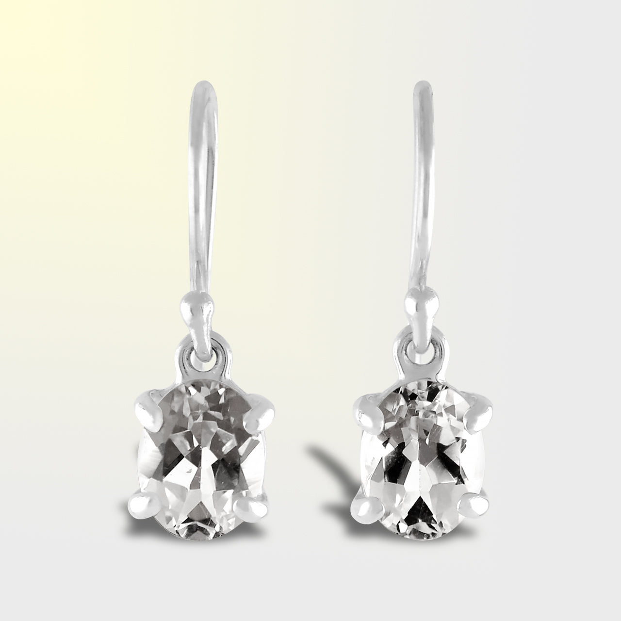 Starborn Danburite Faceted Oval Prong Set Dangle Earrings in Sterling Silver