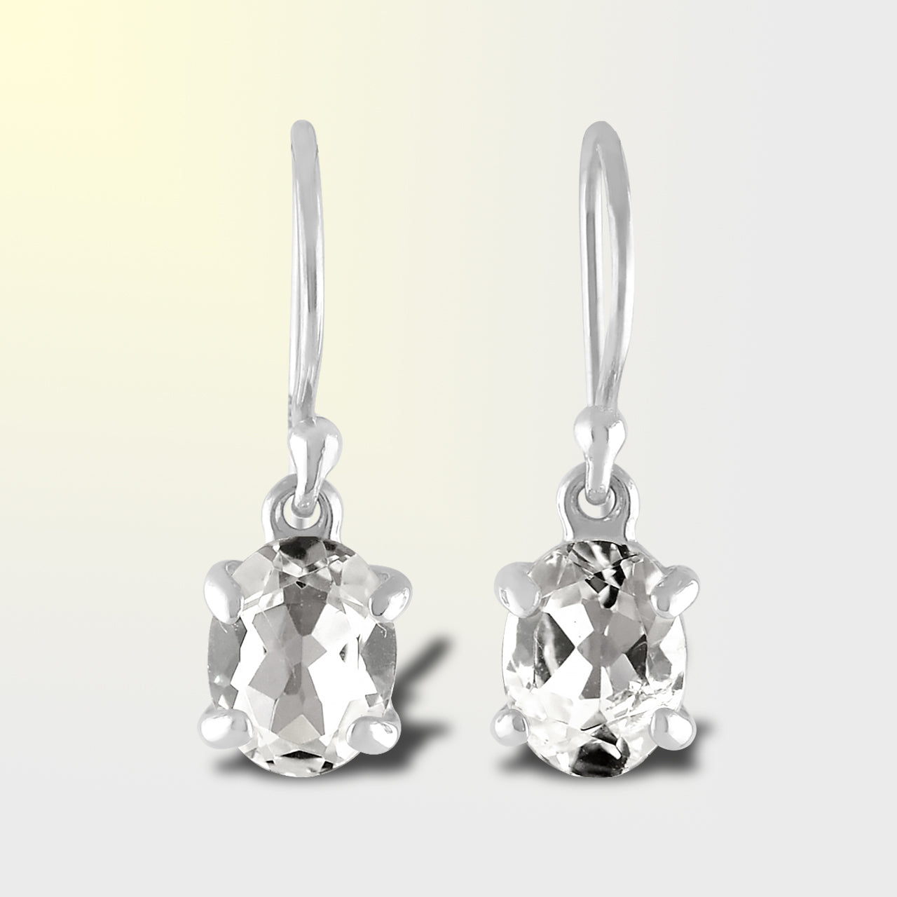 Starborn Danburite Faceted Oval Prong Set Dangle Earrings in Sterling Silver